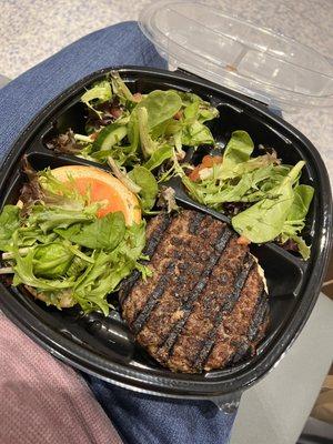 Hamburger with salad.  On my lap because I rushed to the gate only then to be delayed. ‍