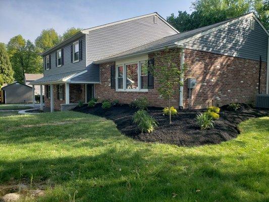 New bed and landscape to corner of house.