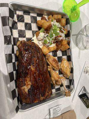 Ribs and wings with loaded tots