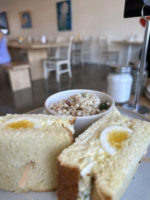 Egg salad sandwich and side of couscous