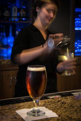 Bartender and Backlit bar area