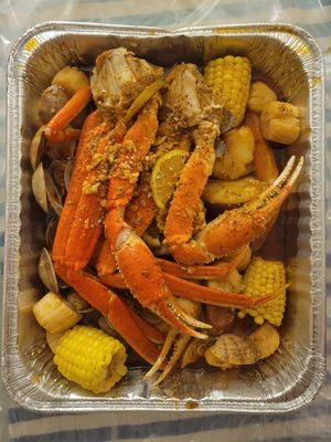 Seafood boil: snow crabs, clams and scallops in Pier 23 sauce.