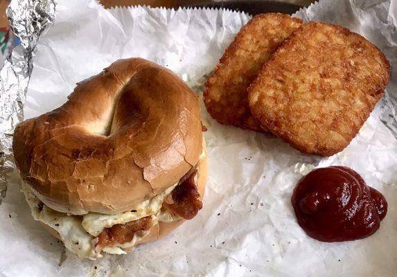 Breakfast menu rocks! Huge bacon egg n' cheese bagel to-go. Side of hash browns.