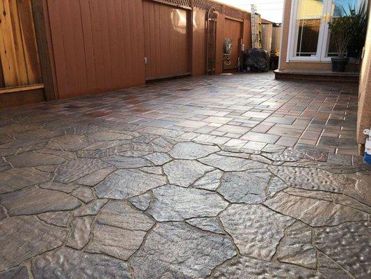 Mega Arbel Patio slab in Toscana,Border in Avalon slate in alternate Barcelona/Toscana