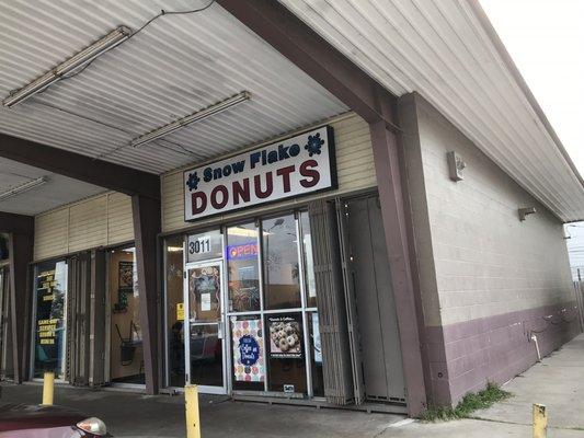 Outside. Easy to miss. Good donuts.