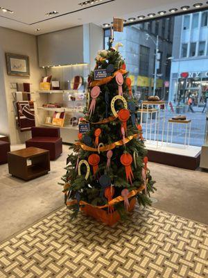 Hermes Christmas tree and interior of store.