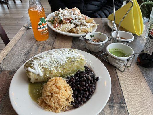 Wet Burrito with Chicken and Green sauce, plus chicken nachos in the background.