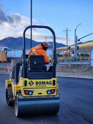 Compacting the newly laid asphalt