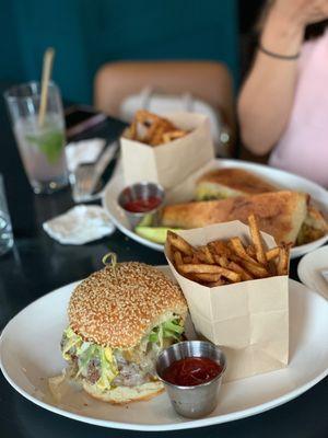 Burger from the brunch menu and the Cuban sandwich in the background