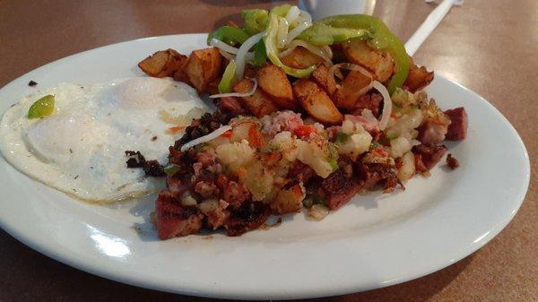 Corned Beef Hash with over easy eggs and Country potatoes