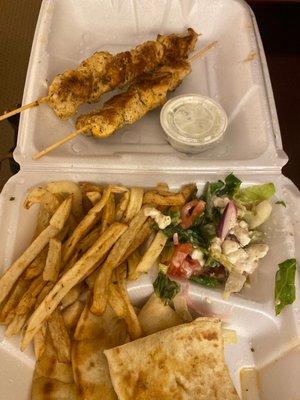 Open face souvlaki chicken meal.