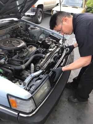 Brian working on my hood not closing properly