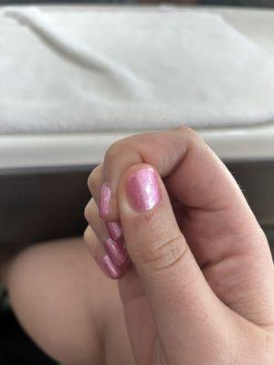 The paint on my pointer finger not reaching the edge of my nail. I asked for rounded nails and my finger comes to a point there