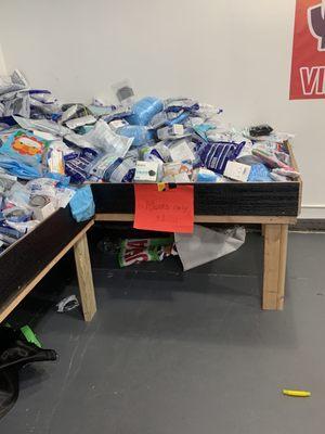 Bin with masks for sale inside store