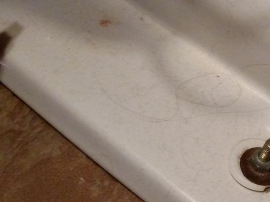 Hair all over the bathroom, with holes in shower poorly filled with caulk.  Mice droppings behind all furniture.