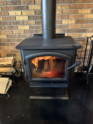 Wood-burning stove, doing what it's meant to do...heating the house.