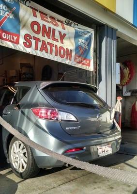 My Mazda 3 getting its first smog check. Next one in 4 years.