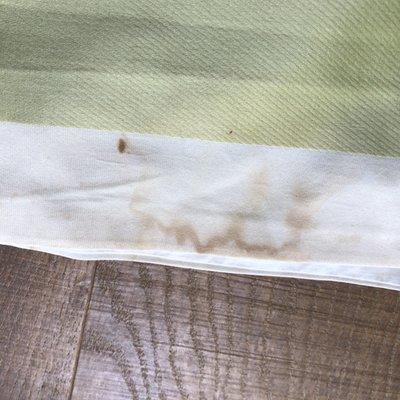 Dirt, stains, and grime still on linens after I took them home.