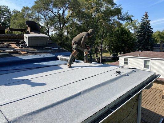 The crew working on sealing our flattop roof.