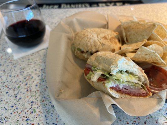 Italian Sandwich with chips and salsa & a glass of Pinot Noir