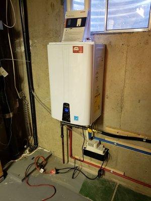 This is a Navien tankless water heater that we installed, with recirculation to the upstairs.