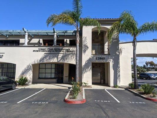 Front of the building with close parking spots and elevator