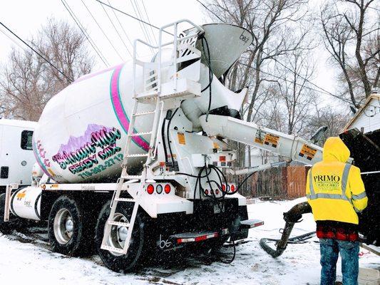 This is a picture of one of our mixer trucks pouring into a pumper.