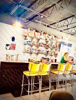 Sunny, yellow environment & inviting retro stylized atmosphere as well as cheery folks!!!!