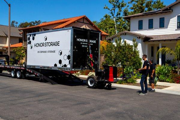 Storage container (8x16x8) being delivered to a residence