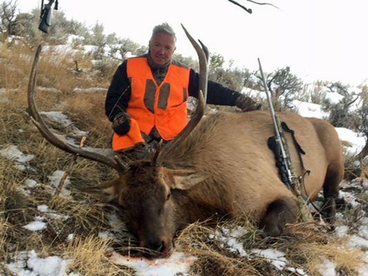 Kevin Arquit (NY) harvests his first bull elk on his 2017 guided rifle hunt with Stockton Outfitters.