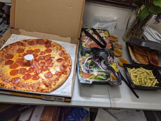 Large Pepperoni Pizza, Garden Salad, Antipasto Salad, Pesto Pasta, and their delicious Bread.