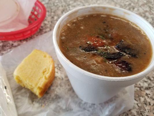 A bowl of the Uncle Mike's Gumbo with sausage, and a piece of homemade cornbread. Both most excellent!