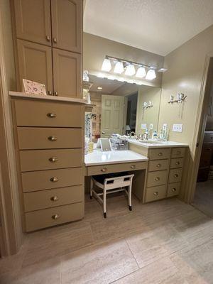 Completed bath on the South side with custom cabinets to maximize storage, and makeup area.