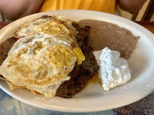 Chilaquiles with sauce and egg and beef $17 was heavy but good