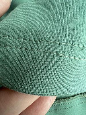 Micro-tears in the fabric from the hem job