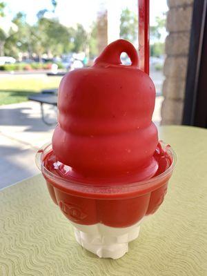 Cherry dipped cone in a cup