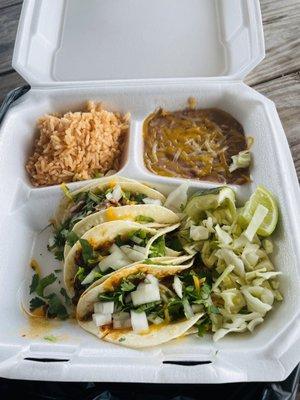 Three carne adovada soft tacos, Mexican rice, refried beans