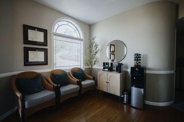 Our patient waiting area with comfy chairs/pillows! We always offer coffee, tea, and water.