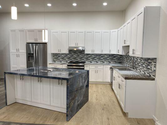 here's a Kitchen we did in our showroom, we installed prefabbed cabinets, we fabricated & Installed the countertops.