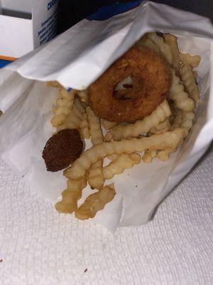 Sack of fries with fried fish and chicken ring in the sack. Smh