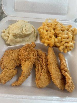 Chicken fingers with mashed potatoes and macaroni and cheese