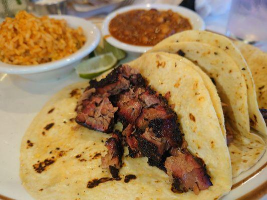 Pulled brisket tacos, rice and bbq beans. Heaven on a plate