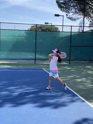 Ianna demonstrating her perfect follow-through on her backhand side