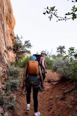 Lots of hiking and climbing before repelling! Zion Guru has backpacks you can use & provide all helmets & harness.