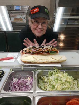 Sandwich artist and a sandwich