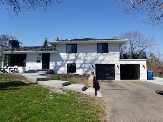 Exterior makeover - Siding LP Smartside Expert finish in Snow Scape and Anderson windows in black.