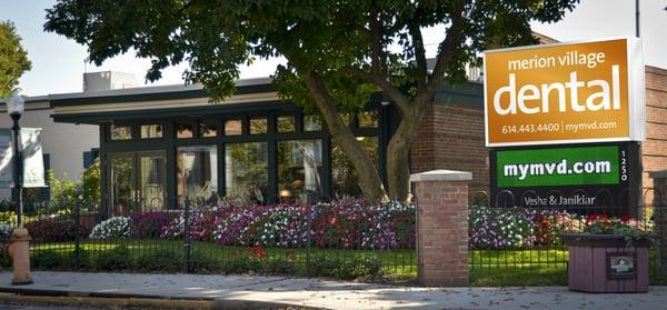 The exterior of Merion Village Dental. Beautiful flower arrangements, calming ambiance and even ducks on our pond!