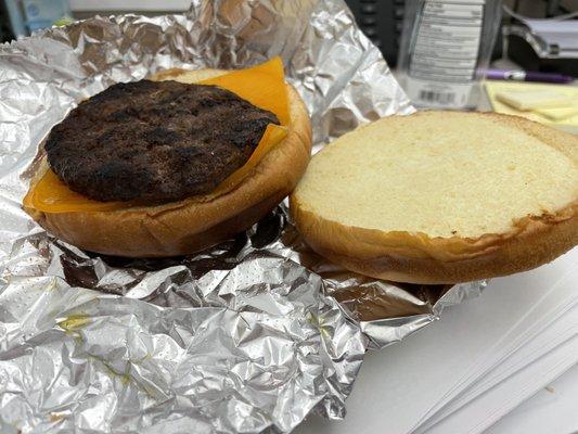 What the burger looked like, over cooked and lost in the bun