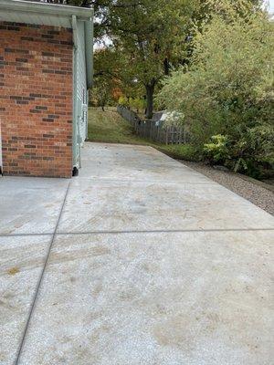 Cement area added to side of garage.