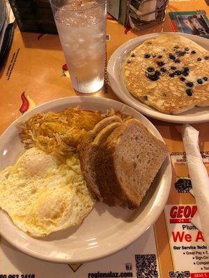 Two egg breakfast + one blueberry pancake